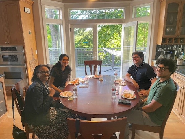 Group sitting around kitchen table.